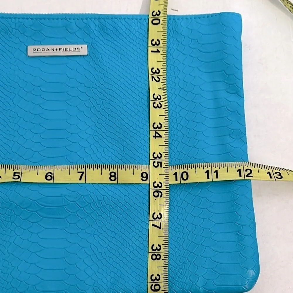 Vibrant Blue Rodan + Fields snake print Cosmetic Bag with Decorative Tassel